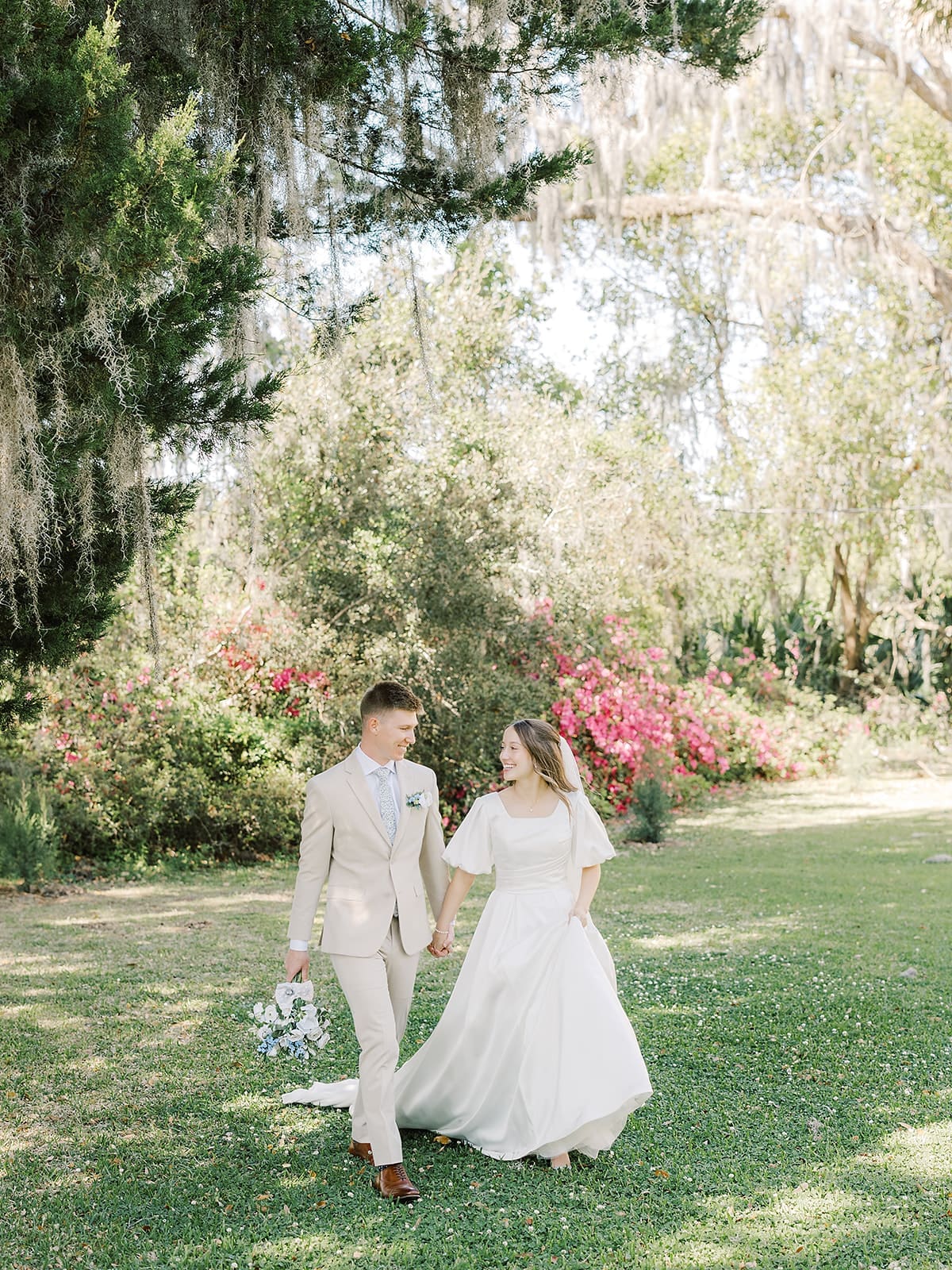 Bride and groom standing together during wedding portraits at Whitefield Chapel at Bethesda Academy in Savannah, Georgia